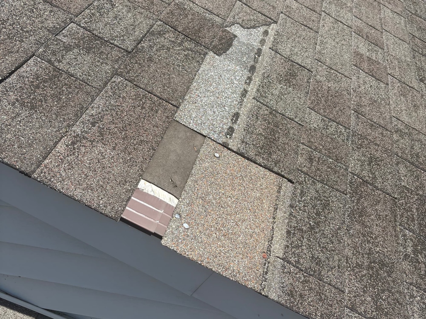 Damaged, mismatched shingles before repair
